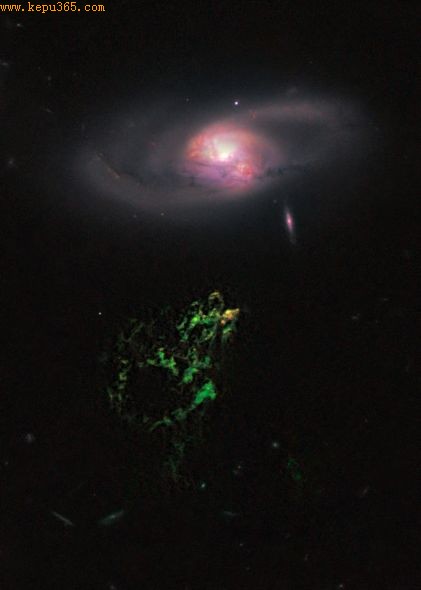 ŹռԶͼУһŹɫƺƯһϵ屻Ϊ塱һ30꣬ΧϵIC 2497ľ޴󻷴һ֡[ȨNASA, ESA, W. Keel (University of Alabama), and the Galaxy Zoo Team]