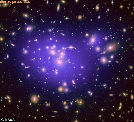 Eternity: Nasa scientists examined how light bends round the Abell 1689 cluster of galaxies, shown here, to explain how the Universe will expand forever